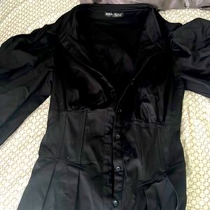 black dress, with puffer sleeves